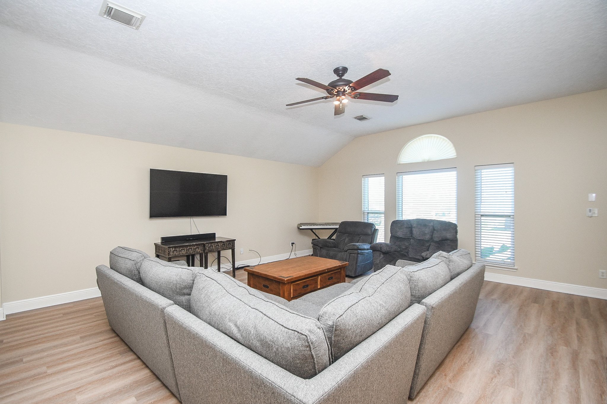 10823 Windswept Montgomery, TX 77356 - Photo 8 of 32 a living room with furniture and a flat screen tv