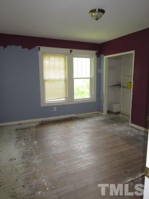 716 Crosby Road Durham, NC 27704 - Photo 11 of 17 a view of an empty room with a window