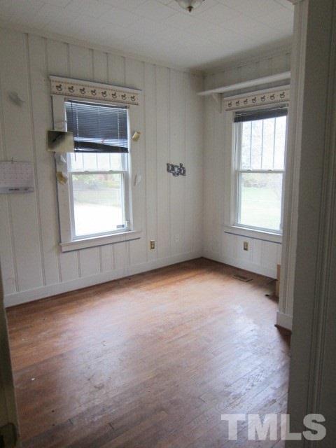 716 Crosby Road Durham, NC 27704 - Photo 12 of 17 an empty room with a window and mirror