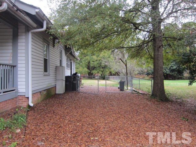 716 Crosby Road Durham, NC 27704 - Photo 15 of 17 a view of a house with a backyard