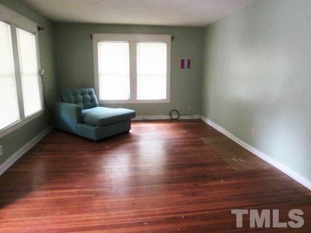 716 Crosby Road Durham, NC 27704 - Photo 3 of 17 a living room with furniture and a hard wood floor