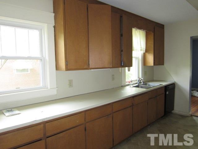 716 Crosby Road Durham, NC 27704 - Photo 8 of 17 a bathroom with a sink and a window