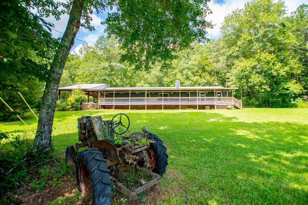 a view of a chair and table in the garden