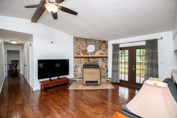 a living room with furniture and a flat screen tv
