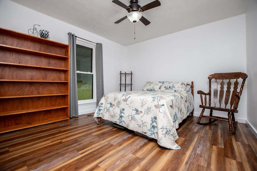 323 Newman Road Franklin, GA 30217 - Photo 15 of 47 a bedroom with a bed and a chair