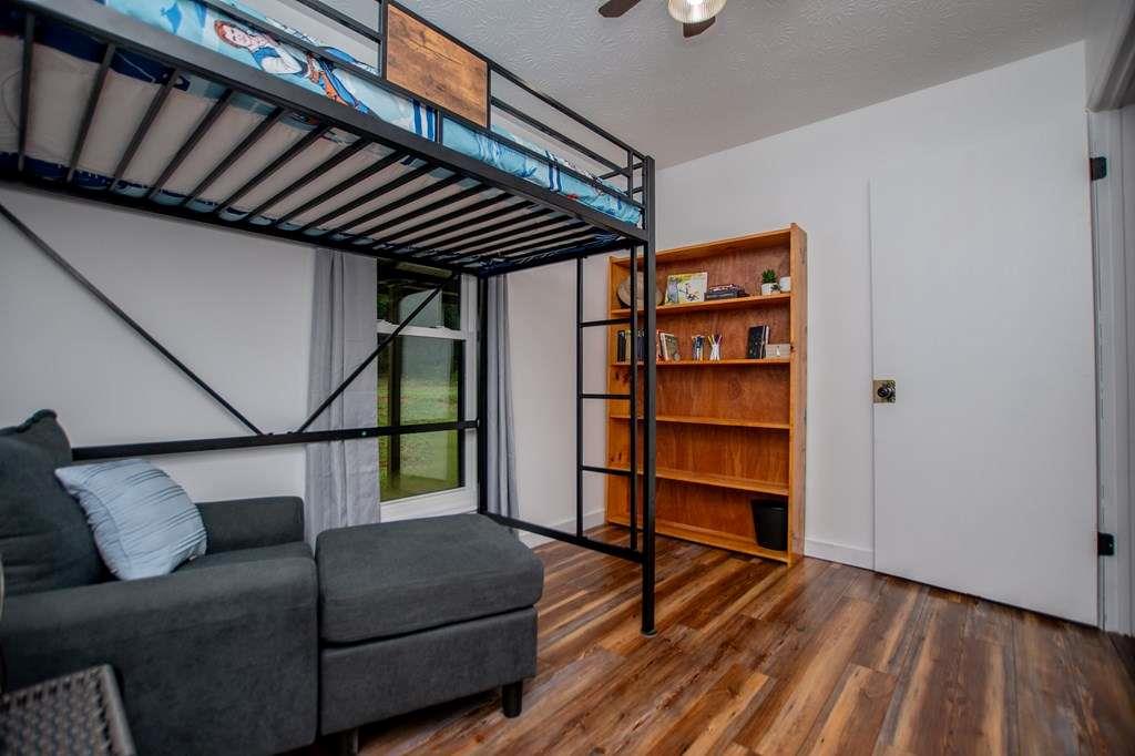 323 Newman Road Franklin, GA 30217 - Photo 17 of 47 a livingroom with furniture and wooden floor