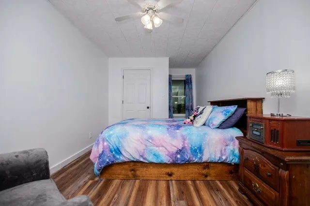 a bedroom with a bed and lamp