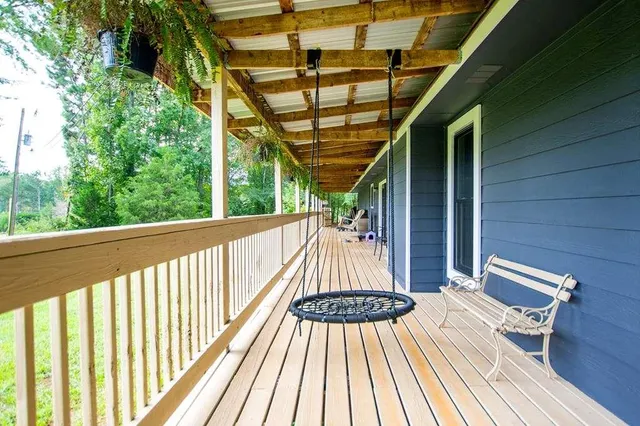 a view of balcony with wooden floor