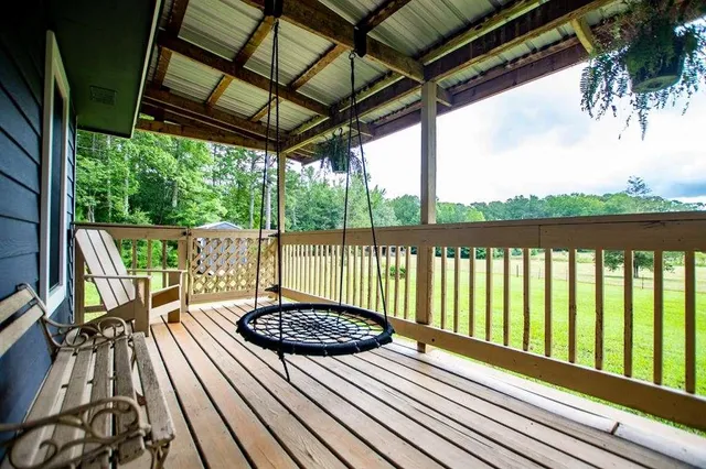 a view of balcony with furniture