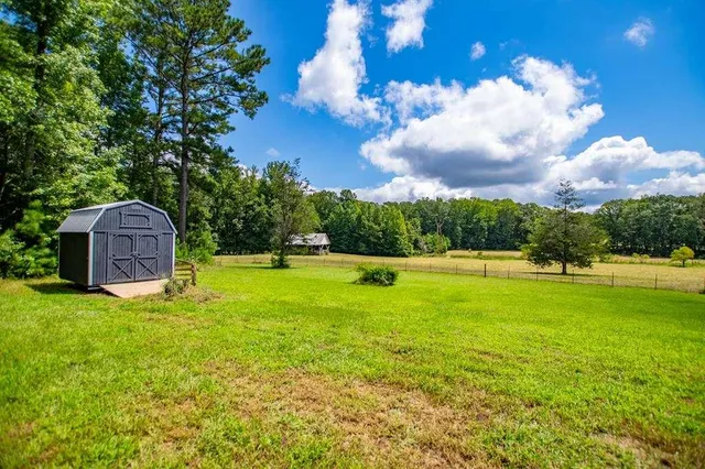 a view of a house with a big yard