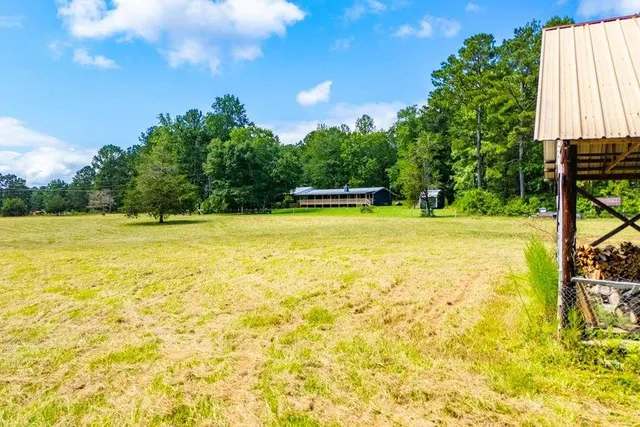 a view of a swimming pool with an outdoor space and seating area