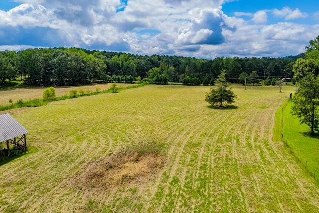 a view of a swimming pool and a yard
