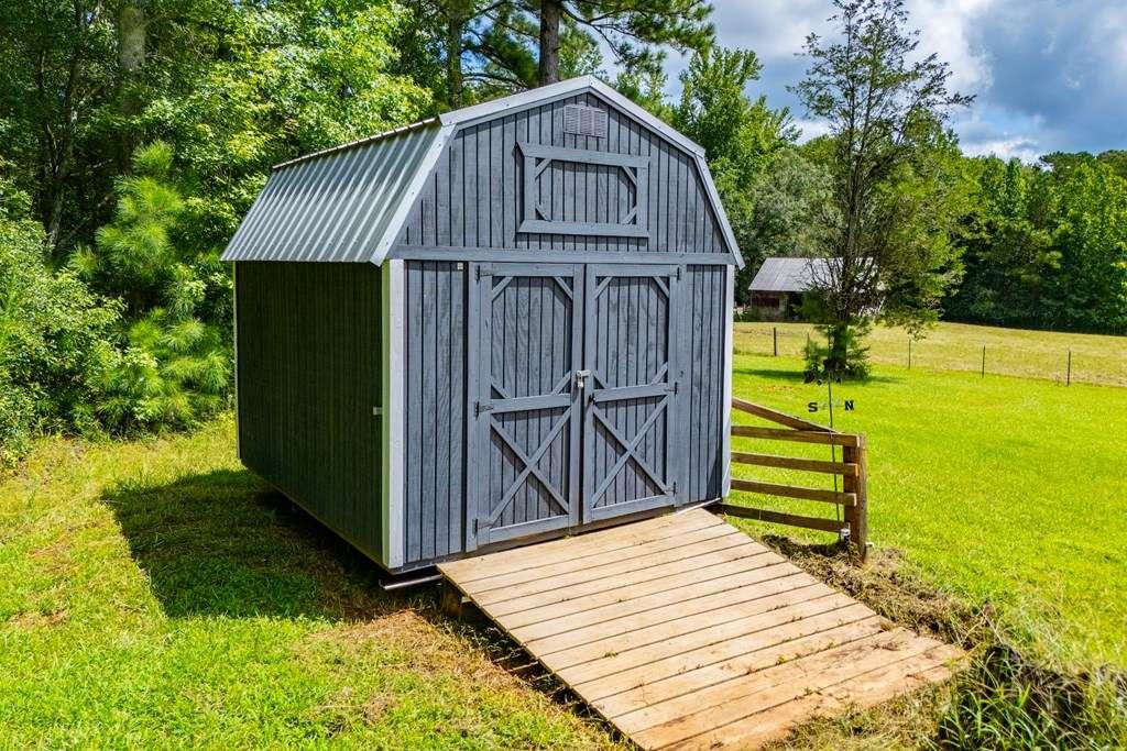323 Newman Road Franklin, GA 30217 - Photo 34 of 47 a view of a house with a yard
