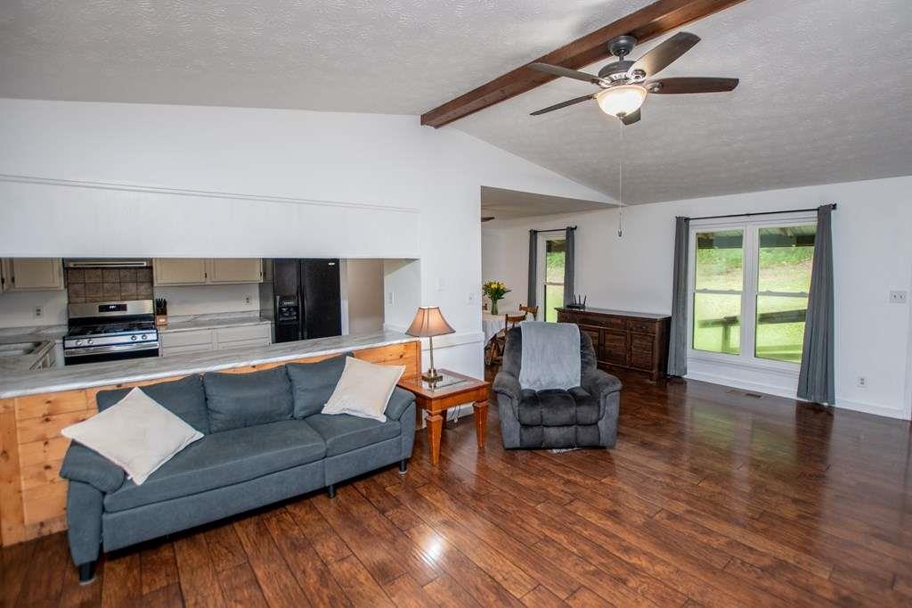 323 Newman Road Franklin, GA 30217 - Photo 7 of 47 a living room with furniture and a flat screen tv