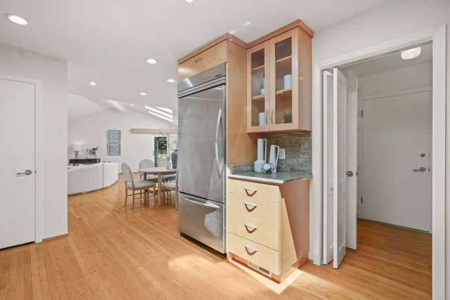 a view of kitchen with furniture and wooden floor