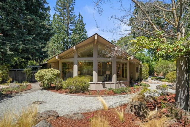 a view of a house with snow on the background