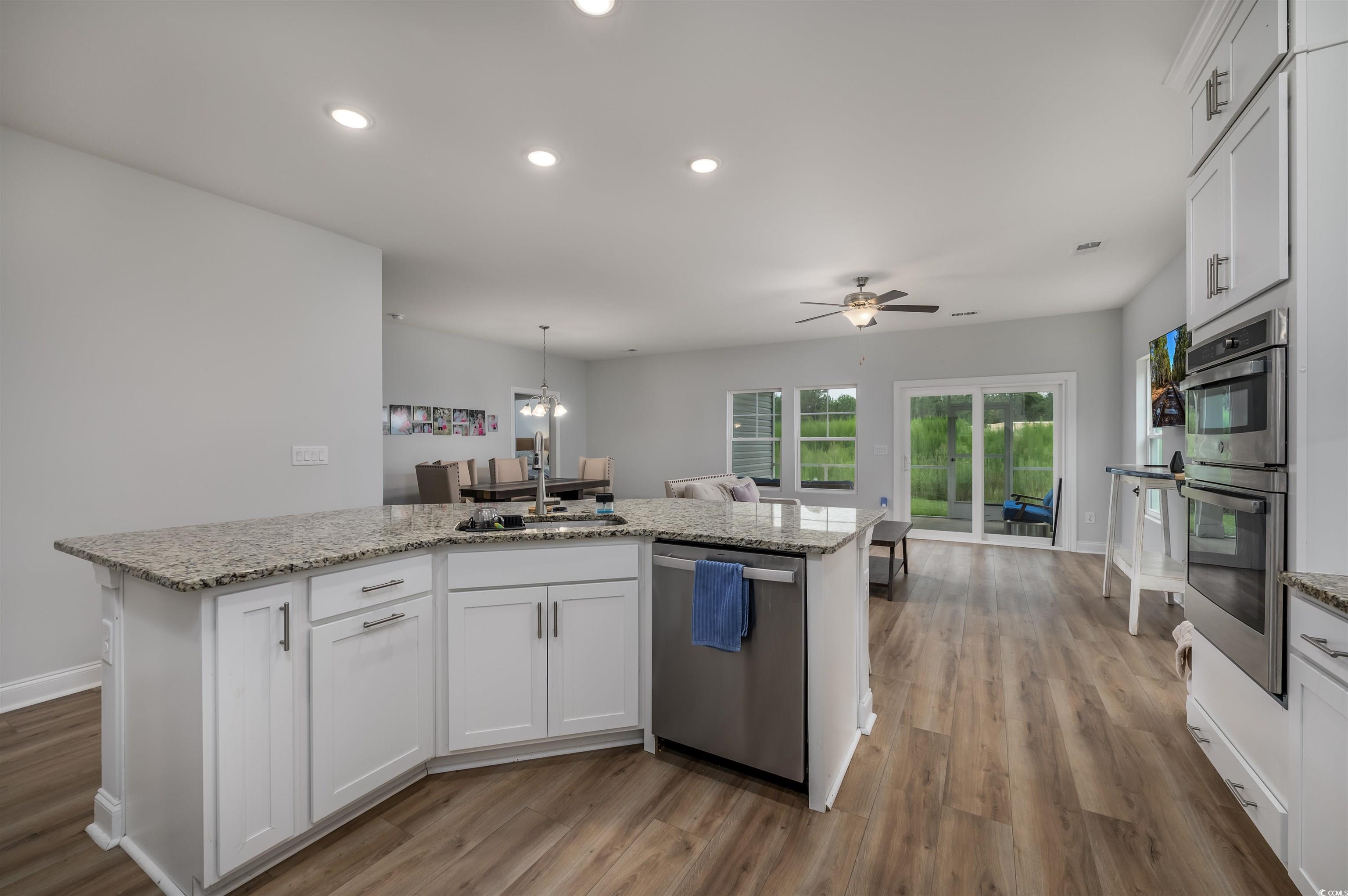2550 Dogwood Road Longs, SC 29568 - Photo 7 of 35 Kitchen featuring white cabinetry, appliances with stainless steel finishes, light wood-style floors, and recessed lighting