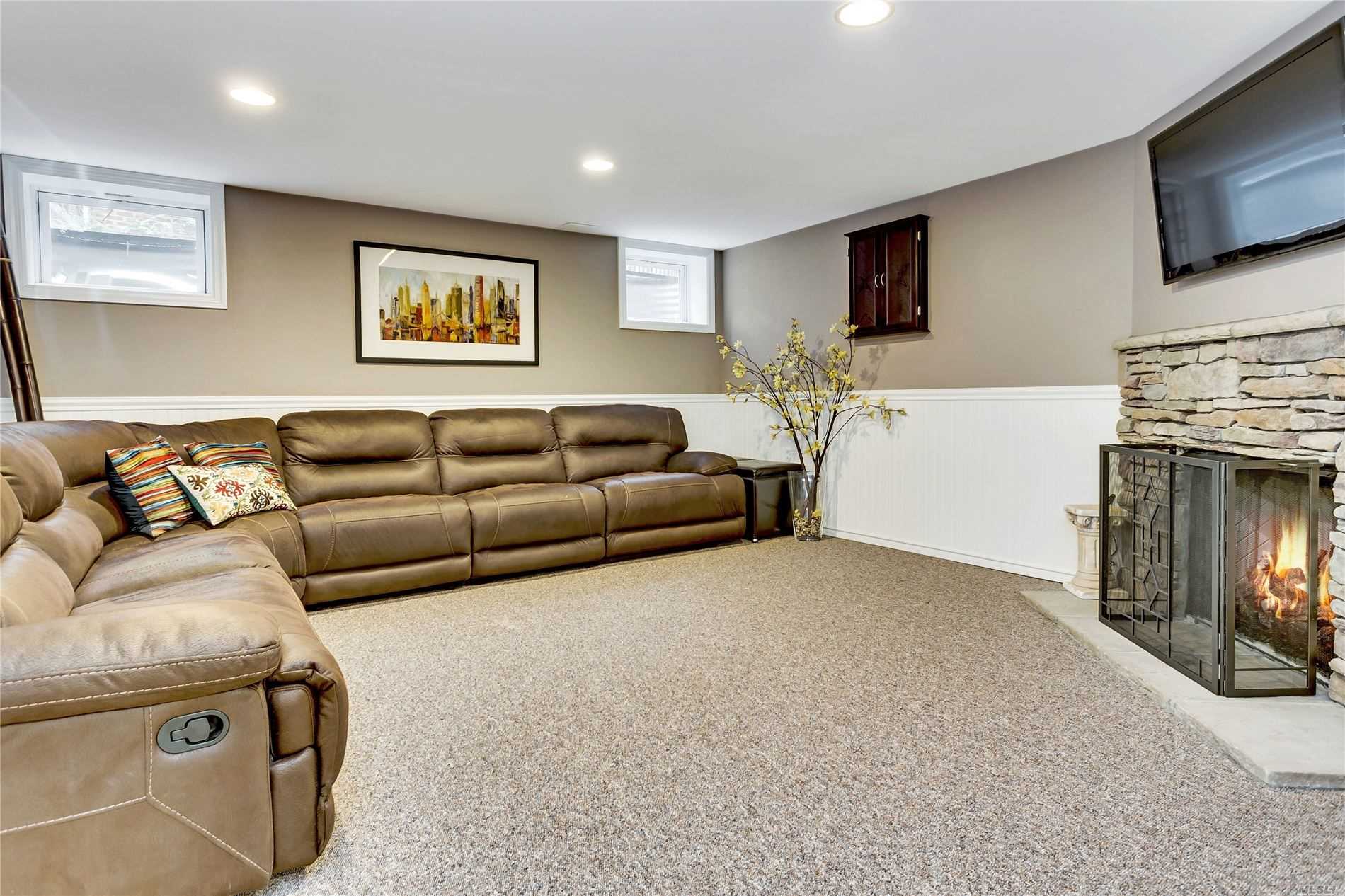 282 Chapel Road Manhasset, NY 11030 - Photo 17 of 20 Lower Level Family Room w fireplace