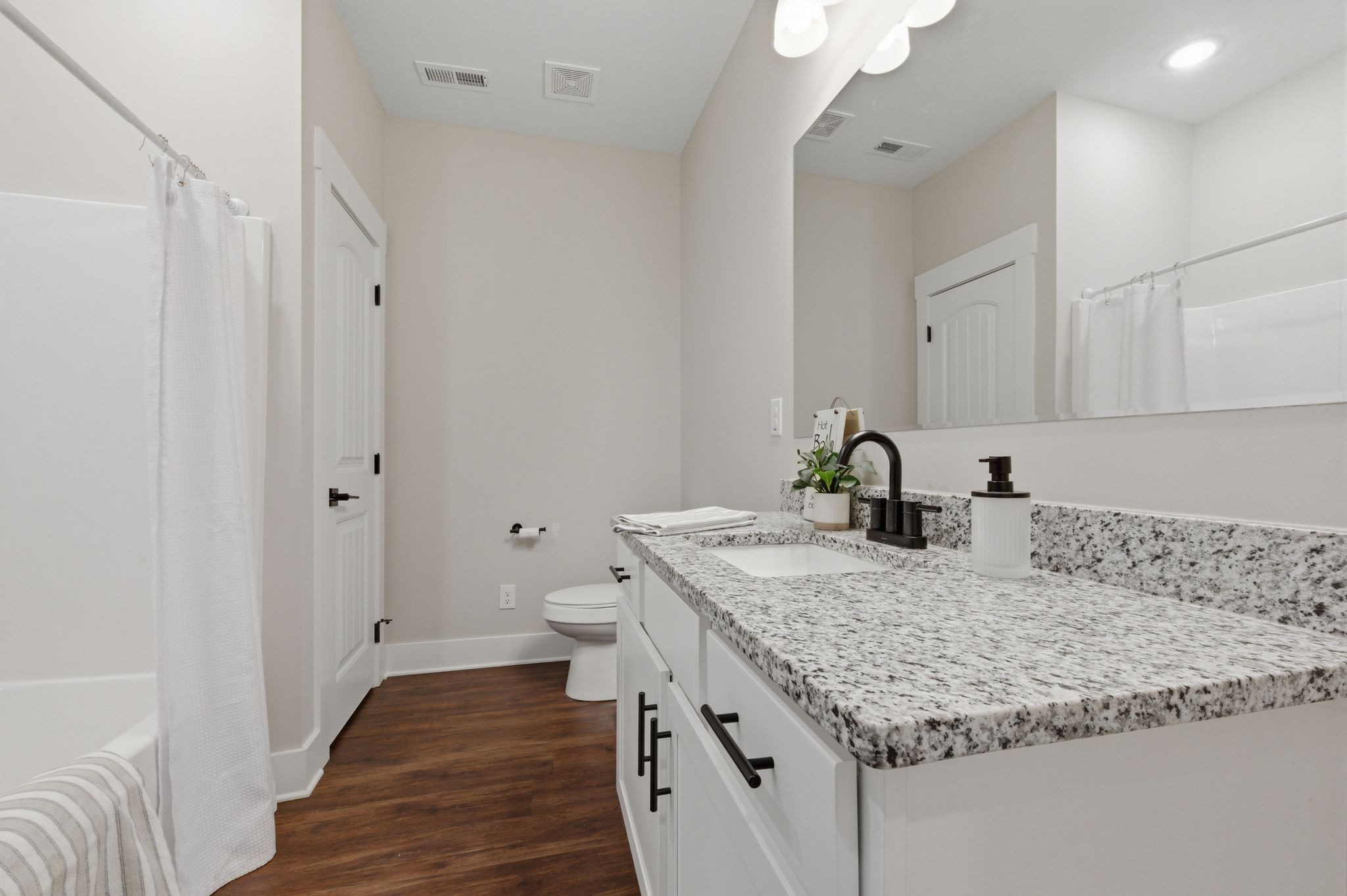 454 Gum Branch Road Burns, TN 37029 - Photo 28 of 36 a bathroom with a granite countertop sink and a mirror