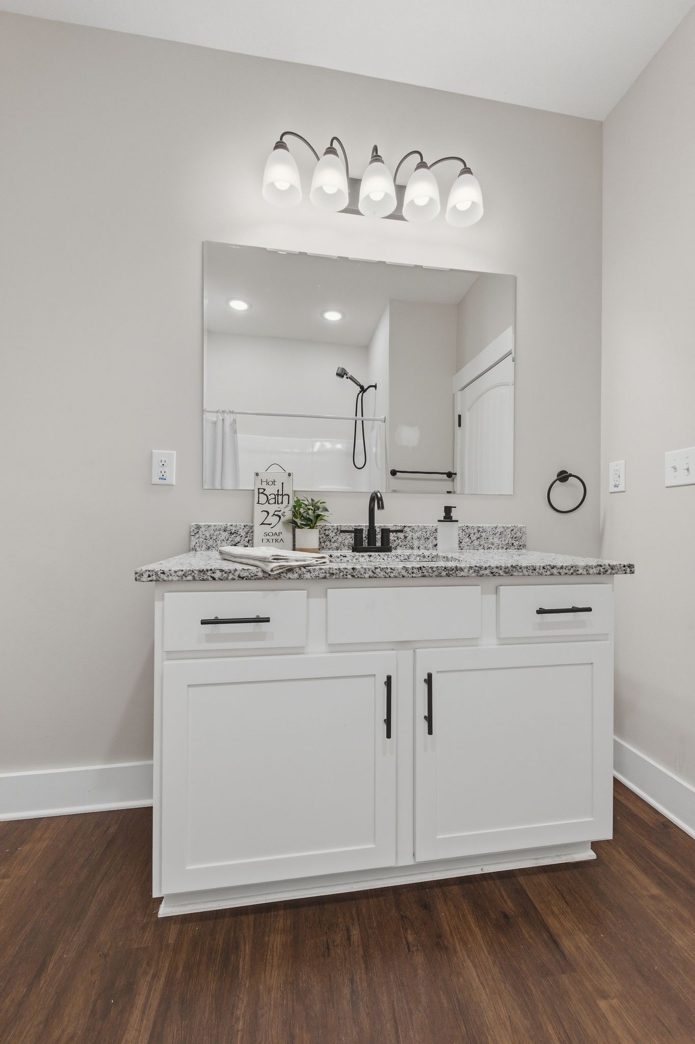 454 Gum Branch Road Burns, TN 37029 - Photo 29 of 36 a view with granite countertop white cabinets and a wooden floor