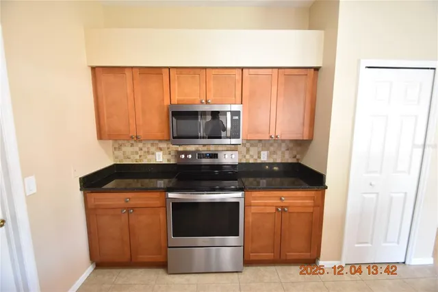 a kitchen with a stove and a microwave