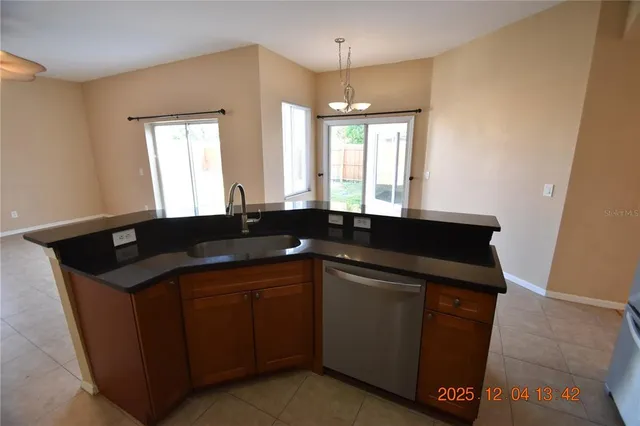 a kitchen with a sink and a window