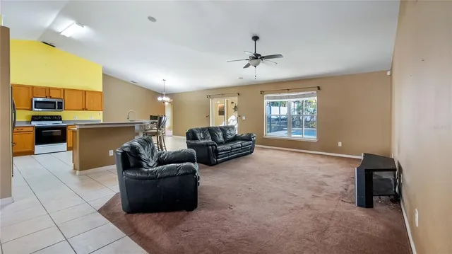 a living room with furniture and a window
