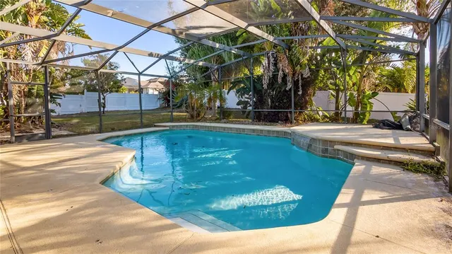 a view of a swimming pool with a patio