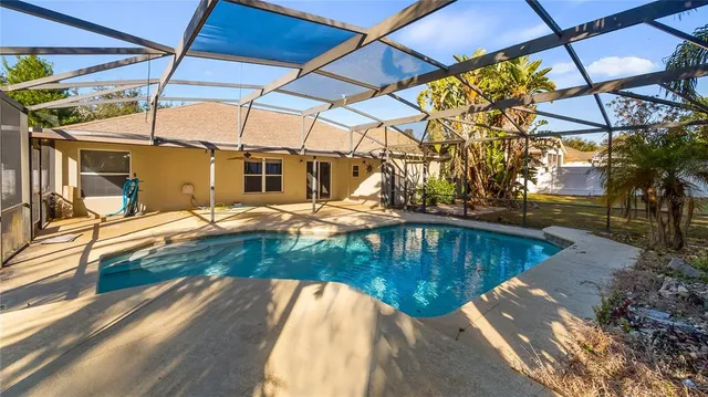 a view of a swimming pool with a patio