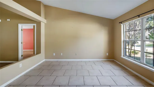 a view of an empty room and window