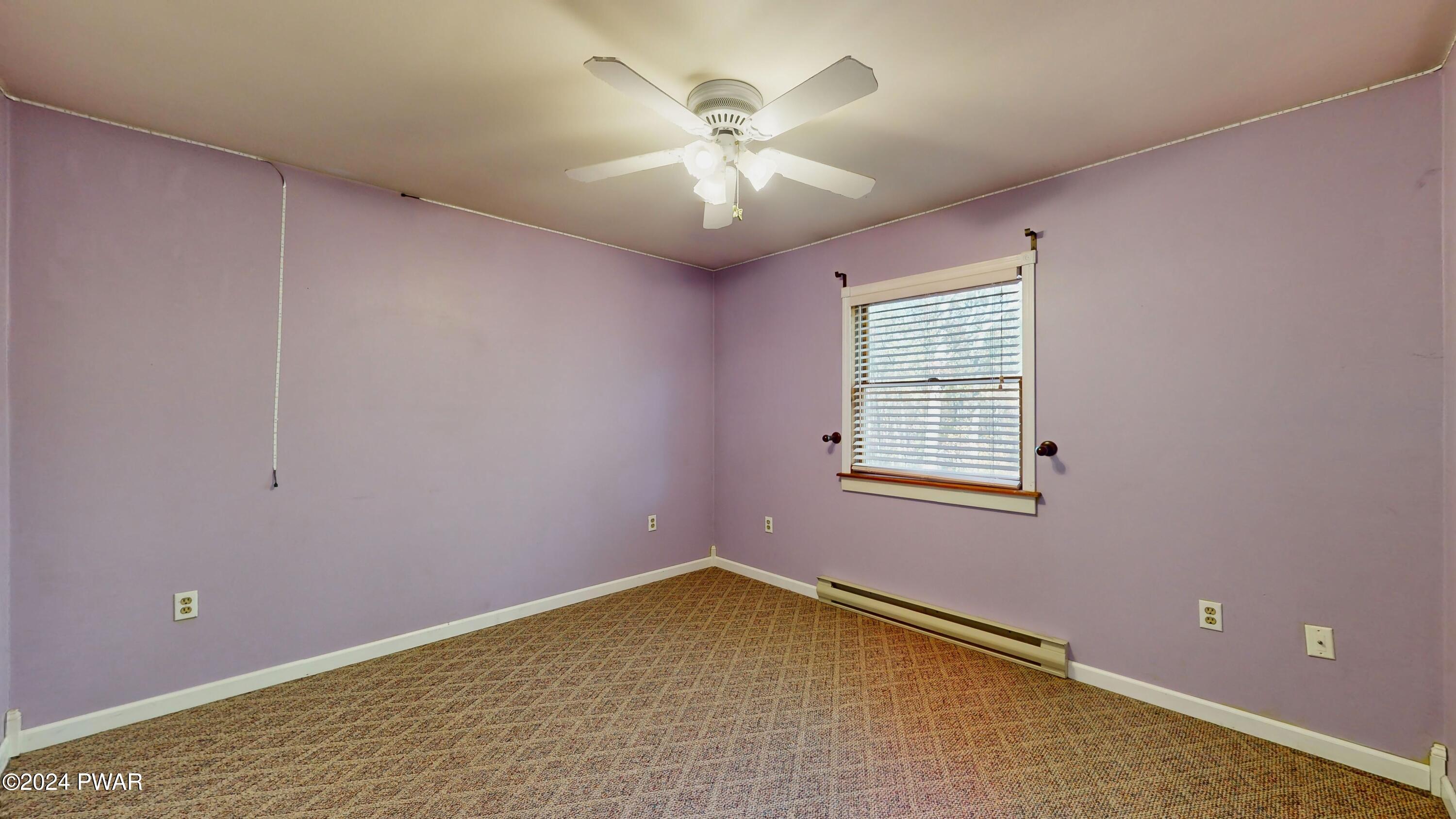 102 Maple Ridge Road Milford, PA 18337 - Photo 21 of 52 a view of an empty room with a chandelier fan