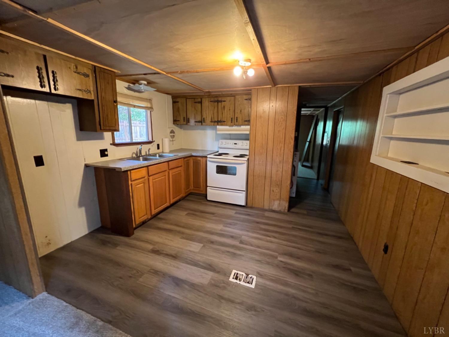 157 White Pine Drive Monroe, VA 24574 - Photo 2 of 13 a kitchen with stainless steel appliances granite countertop a refrigerator a stove and a sink