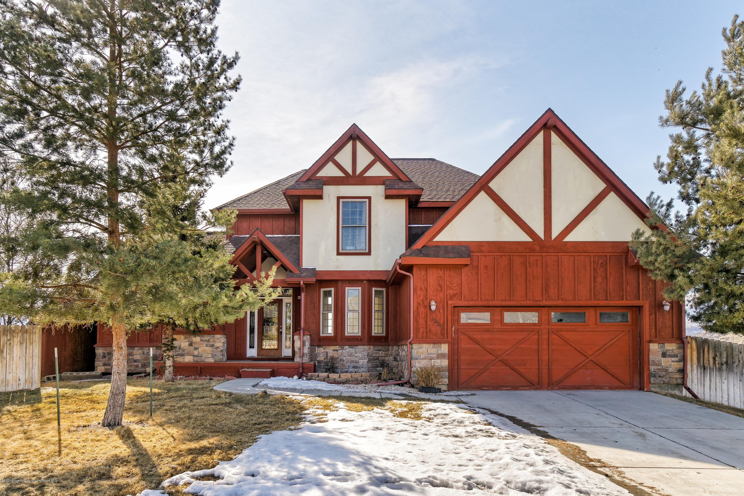 1339 Rifle Heights Drive Rifle, CO 81650 - Photo 1 of 22 a front view of a house with garden