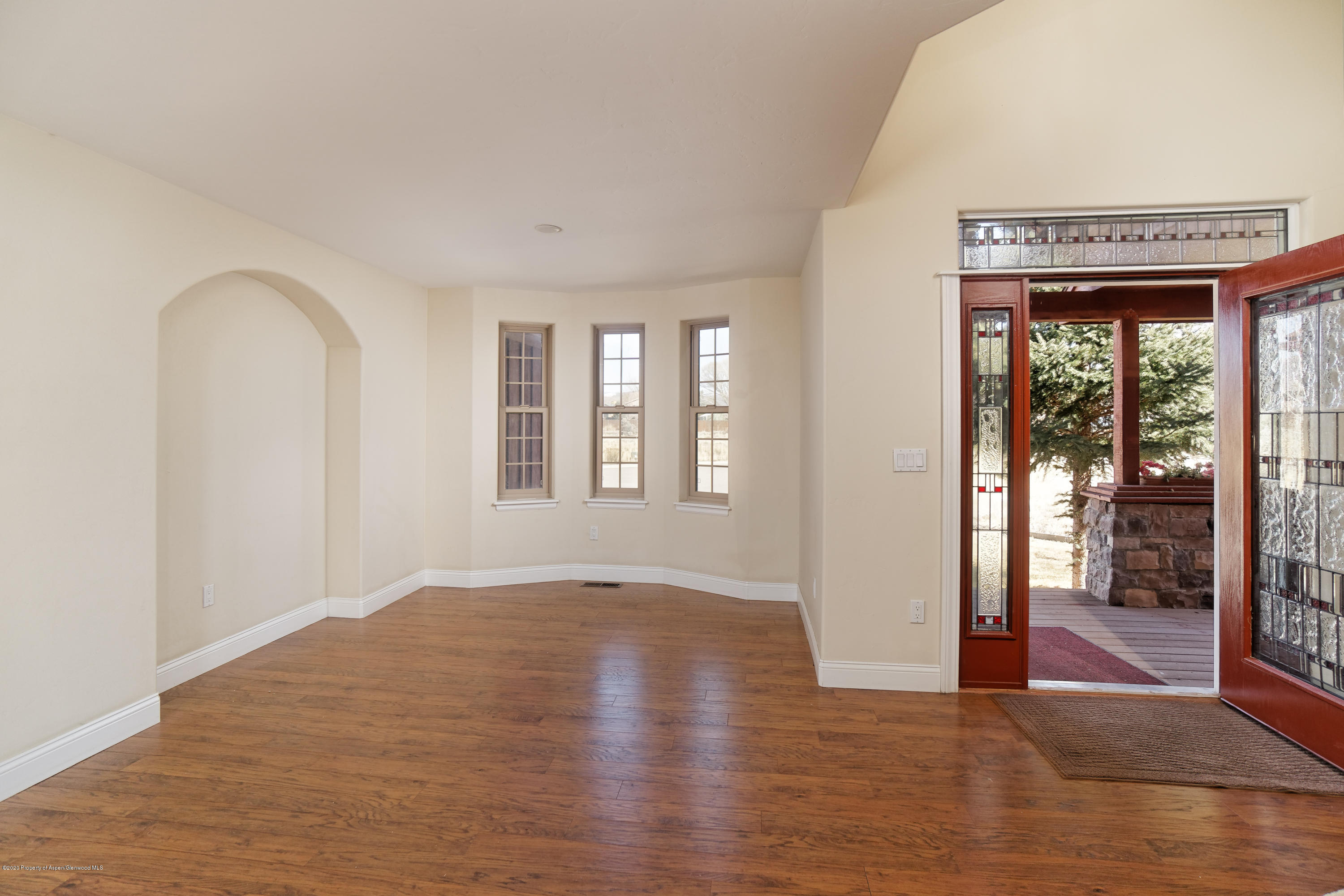 1339 Rifle Heights Drive Rifle, CO 81650 - Photo 3 of 22 a view of an empty room with glass door