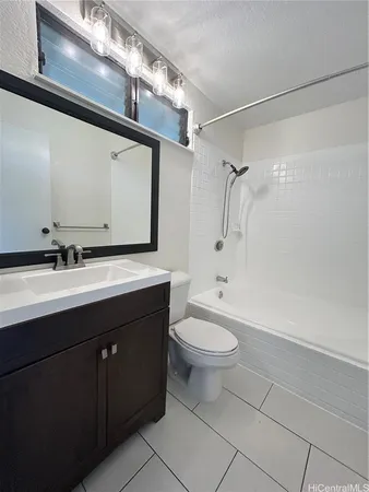 a bathroom with a double vanity sink toilet and shower