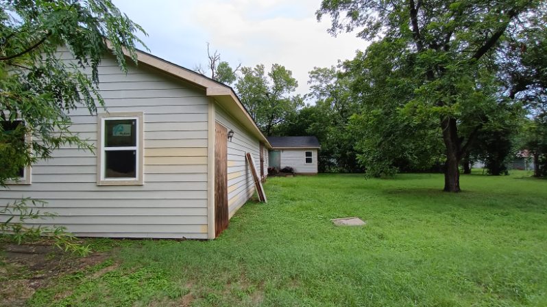 112 Ila Street Elgin, TX 78621 - Photo 17 of 27 a view of a backyard with a garden