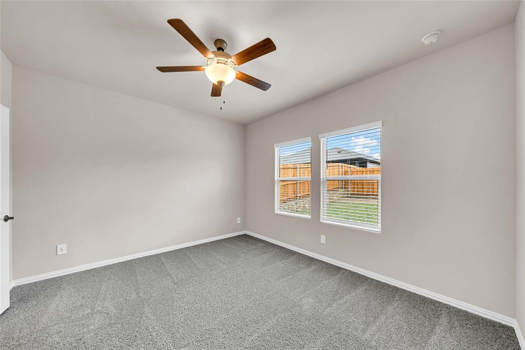417 Martell Road Lowry Crossing, TX 75069 - Photo 15 of 29 an empty room with windows and fan