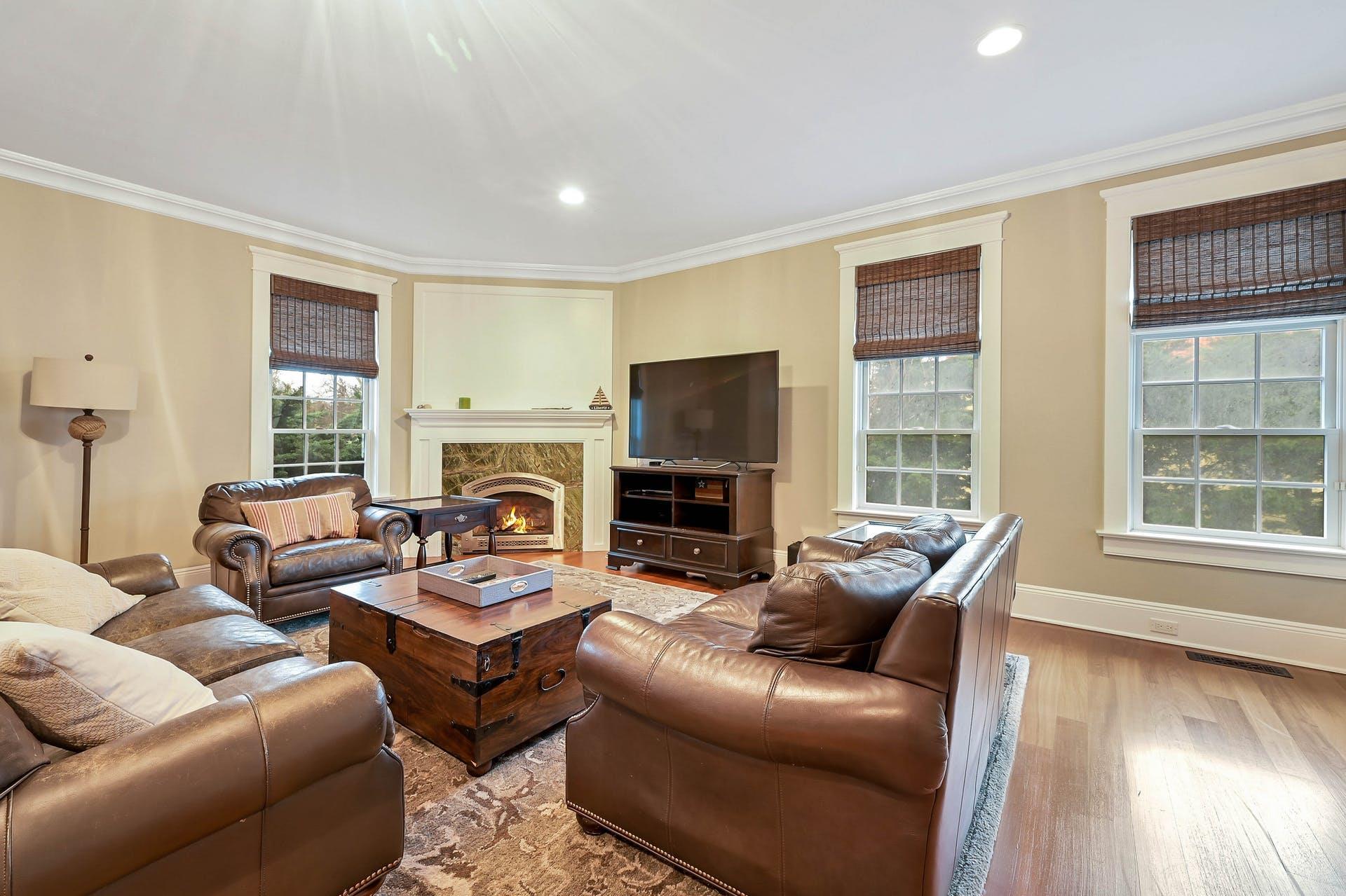 580 Lloyds Lane Mattituck, NY 11952 - Photo 19 of 30 Living room with a fireplace, light hardwood / wood-style flooring, and ornamental molding