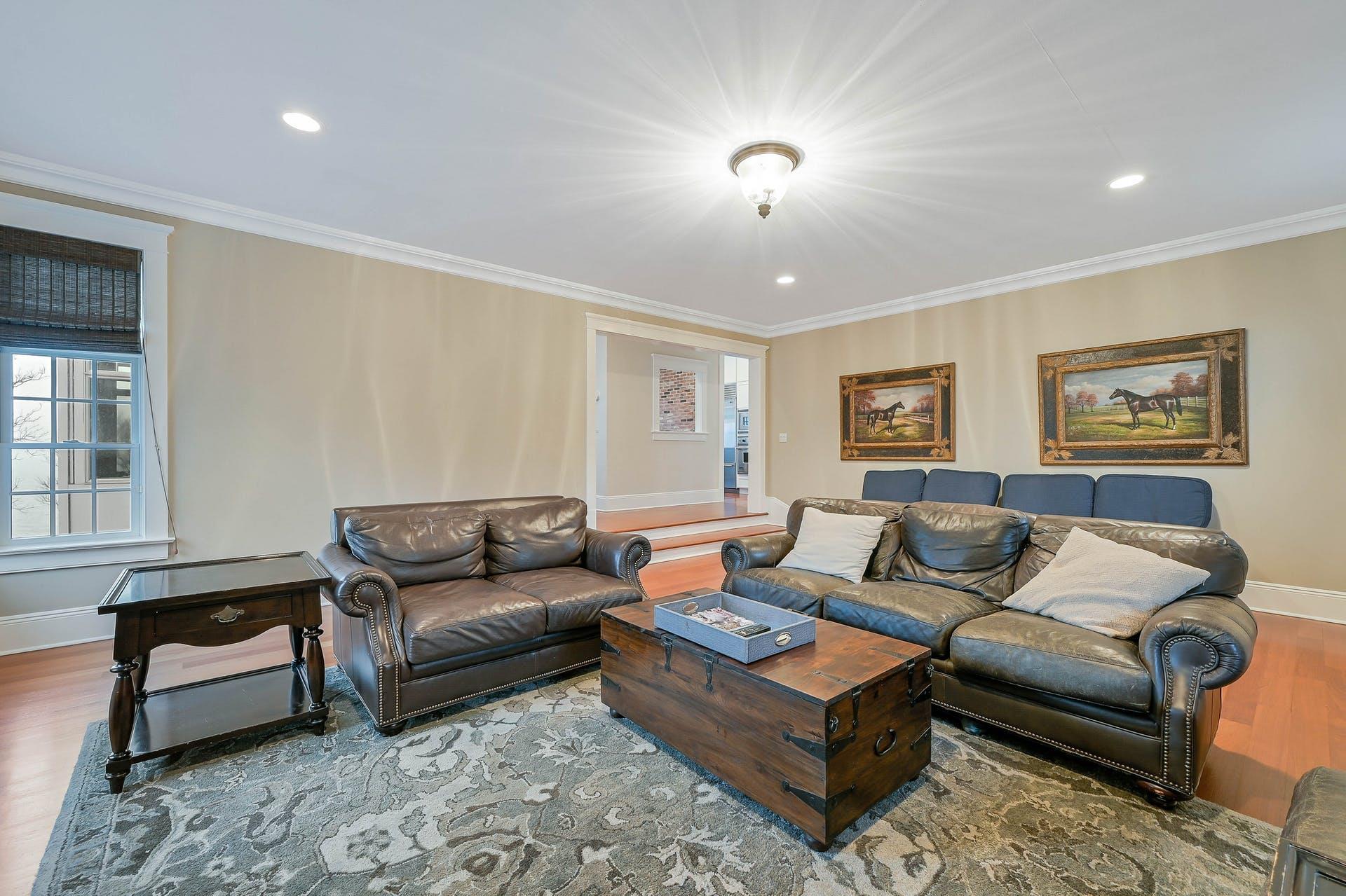 580 Lloyds Lane Mattituck, NY 11952 - Photo 20 of 30 Living room featuring wood-type flooring and crown molding
