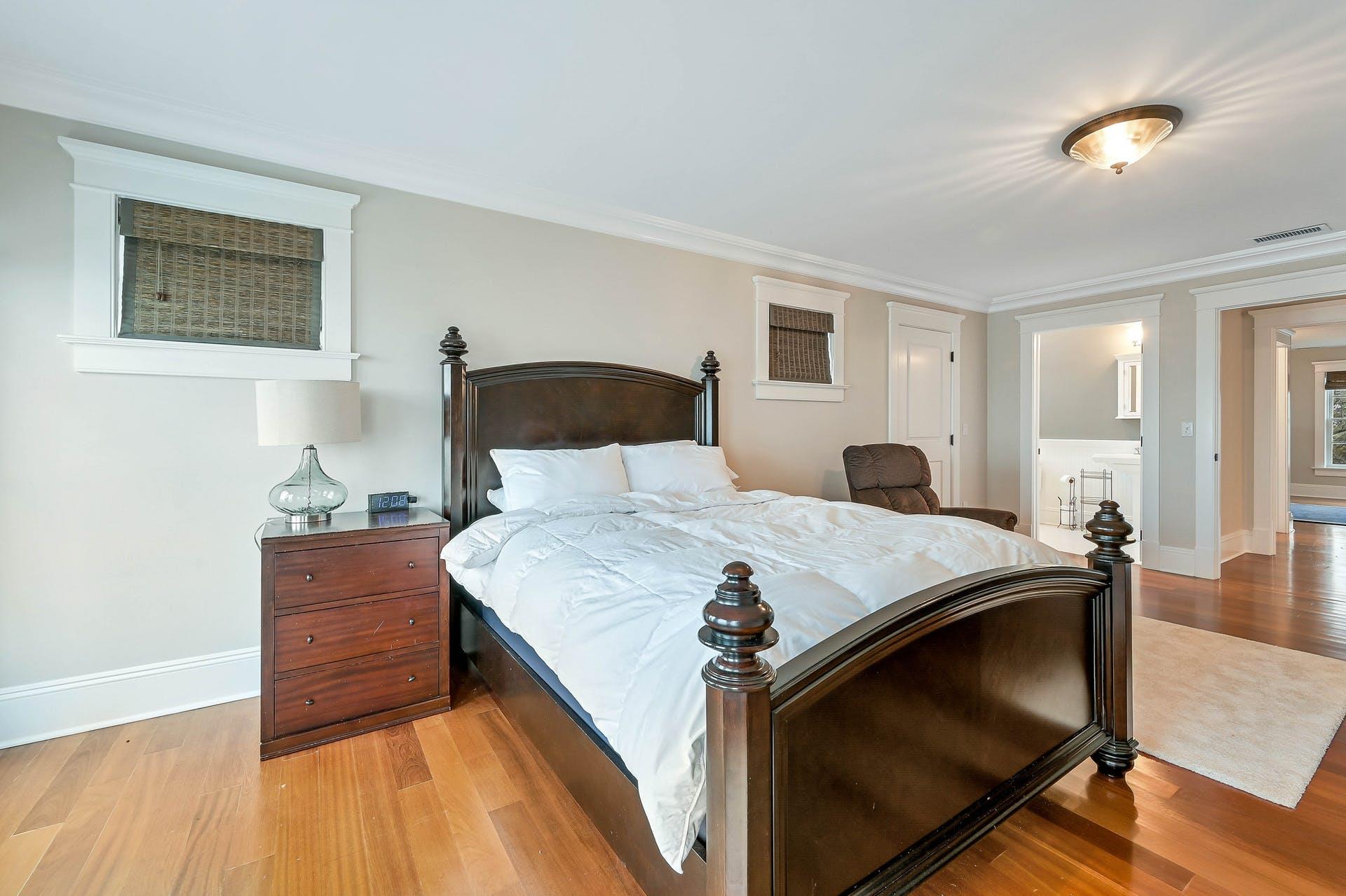 580 Lloyds Lane Mattituck, NY 11952 - Photo 26 of 30 Bedroom with ornamental molding and light wood-type flooring