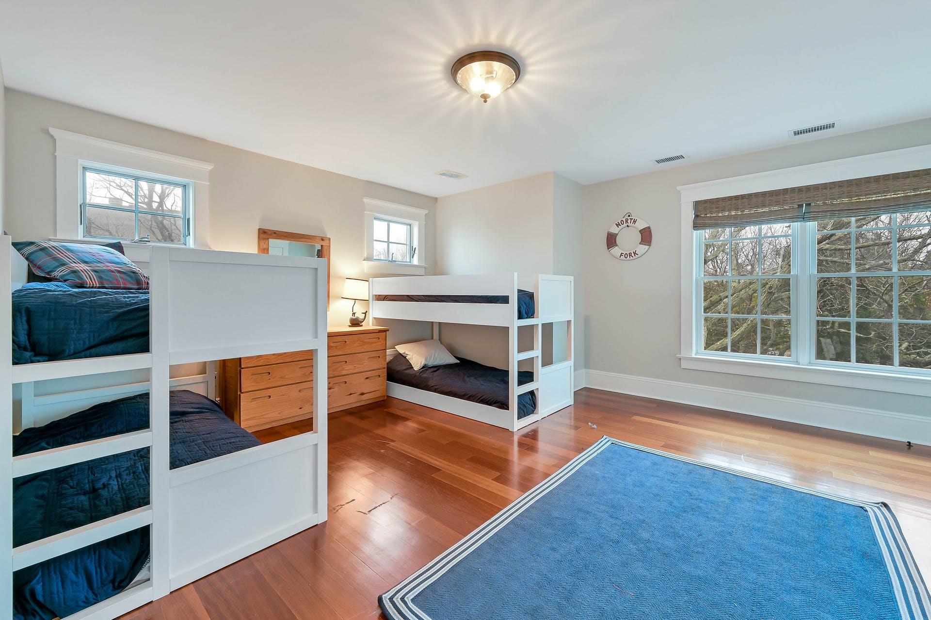 580 Lloyds Lane Mattituck, NY 11952 - Photo 28 of 30 Bedroom with multiple windows and hardwood / wood-style floors