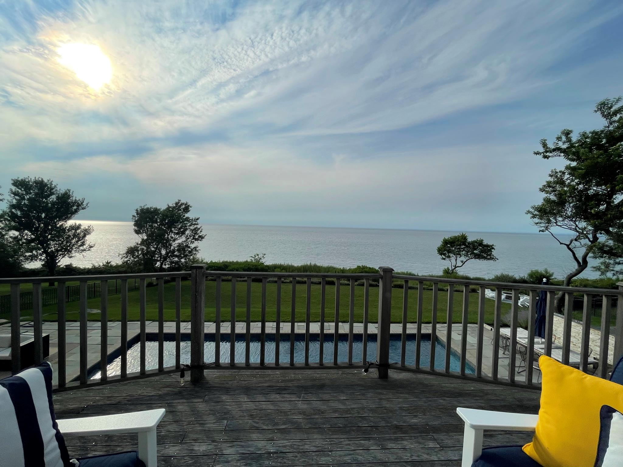580 Lloyds Lane Mattituck, NY 11952 - Photo 3 of 30 Deck featuring a water view and a lawn