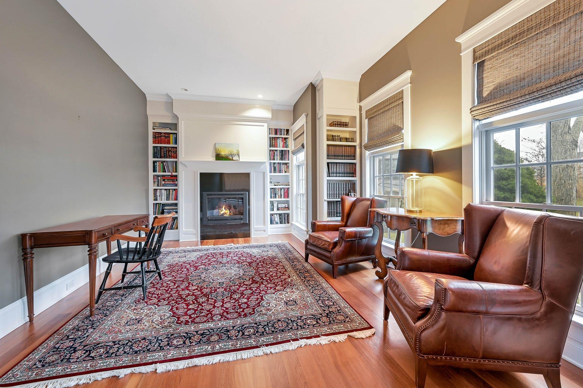 580 Lloyds Lane Mattituck, NY 11952 - Photo 8 of 30 Living room with built in shelves and hardwood / wood-style flooring