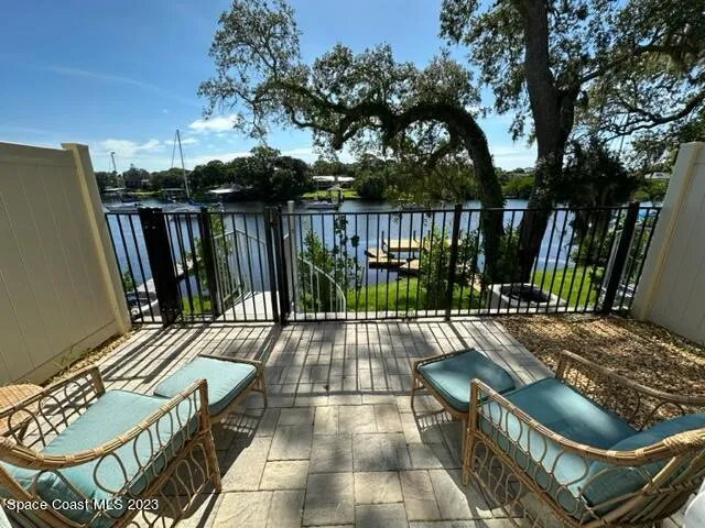 a view of a chairs and tables in the patio
