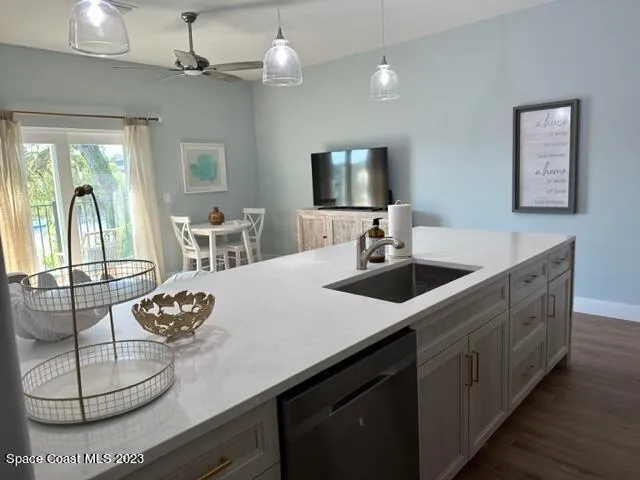 a kitchen with stainless steel appliances a stove microwave and refrigerator