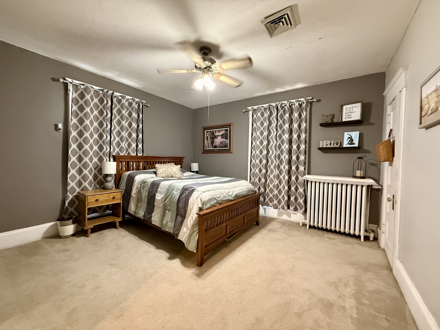 222 West Main Street Clinton, IL 61727 - Photo 18 of 25 a bedroom with a bed and a chandelier