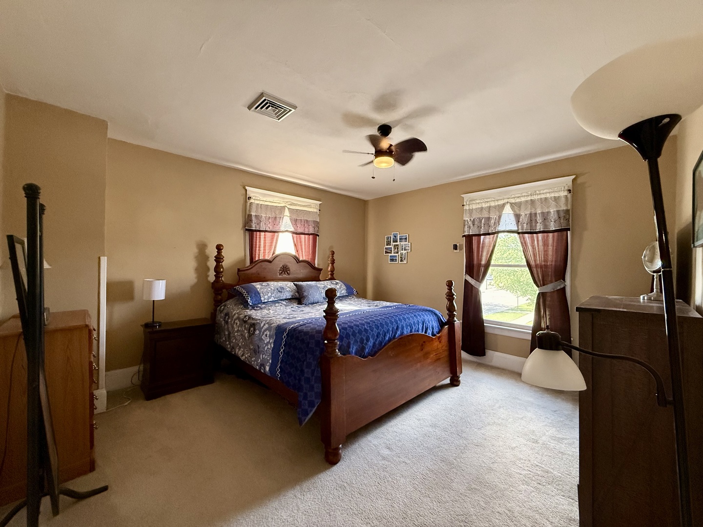222 West Main Street Clinton, IL 61727 - Photo 19 of 25 a bedroom with a bed and a chandelier
