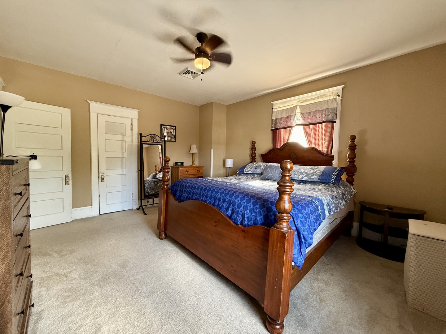 222 West Main Street Clinton, IL 61727 - Photo 20 of 25 a bedroom with a bed and ceiling fan