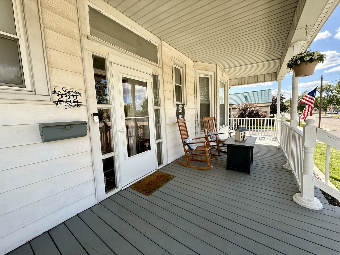 222 West Main Street Clinton, IL 61727 - Photo 2 of 25 a view of outdoor living space with wooden floor and furniture