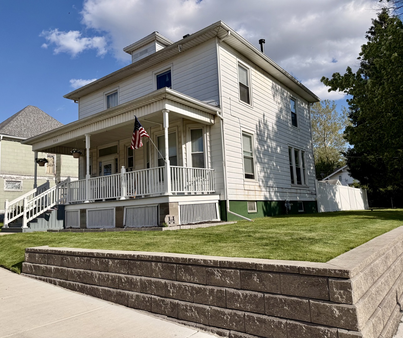 222 West Main Street Clinton, IL 61727 - Photo 24 of 25 a view of a house with a big yard and large trees